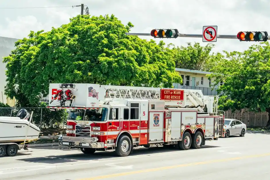City of Miami fire-rescue truck with dive team module on a sunny street.